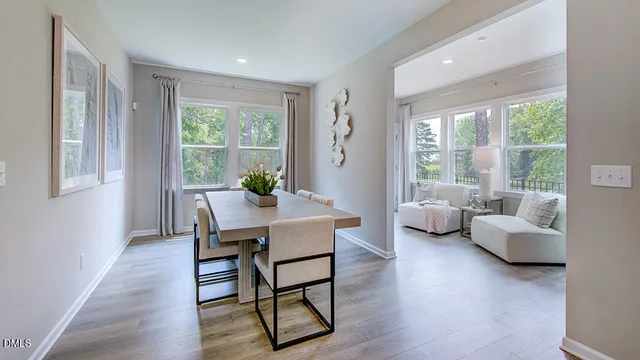 a bedroom with furniture and large windows