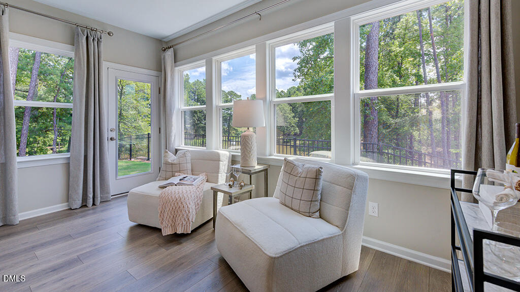 2000 Clydner Drive Apex, NC 27523 - Photo 14 of 36 a bedroom with furniture and large windows