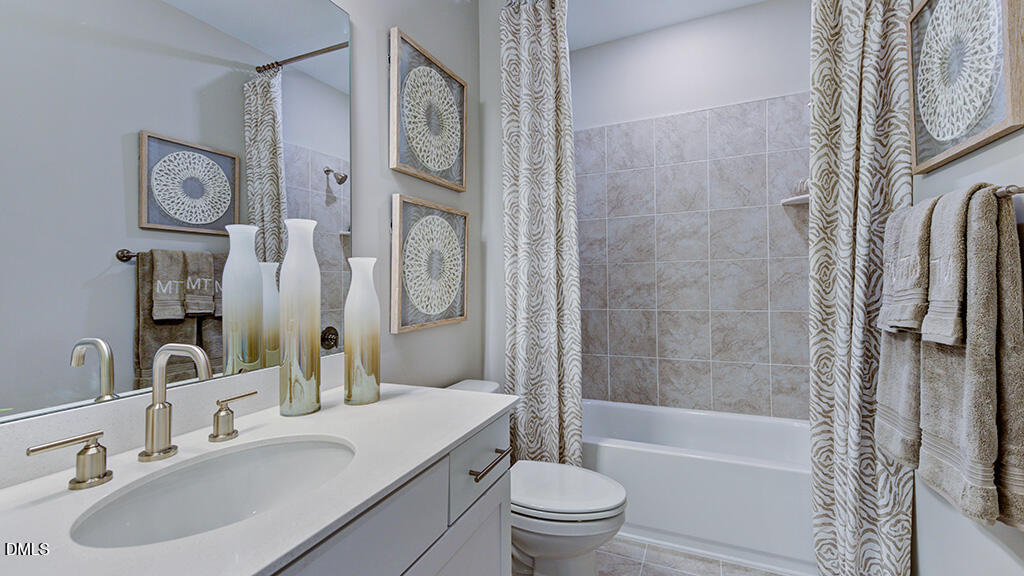2000 Clydner Drive Apex, NC 27523 - Photo 22 of 36 a bathroom with a sink toilet and shower