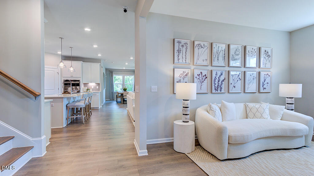 2000 Clydner Drive Apex, NC 27523 - Photo 6 of 36 a living room with furniture and a table