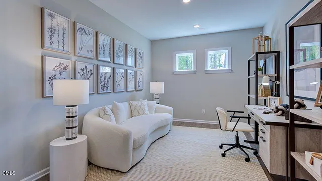 a living room with furniture fireplace and flat screen tv
