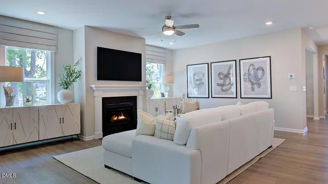 a living room with furniture fireplace and a flat screen tv