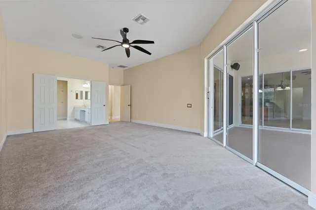 a bathroom with a tub sink shower and mirror