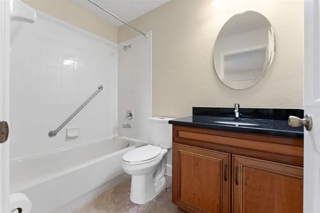 a bathroom with a bathtub and a sink