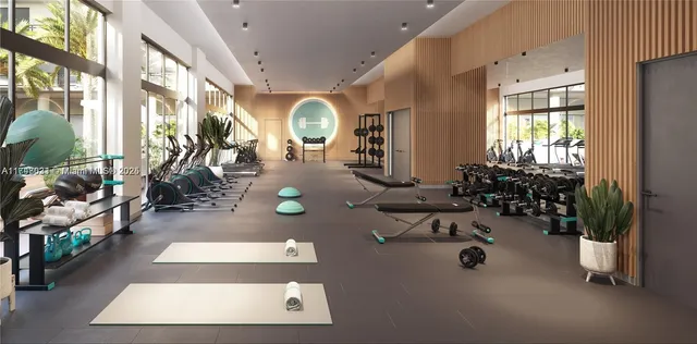 a room with gym equipment and a large window