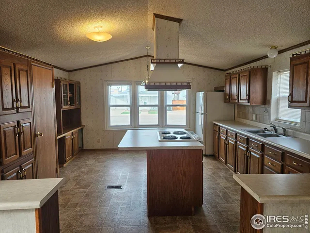 a bathroom with a shower and a sink