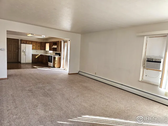 a view of an empty room and window