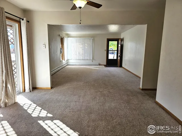 a view of entryway and hall with a window