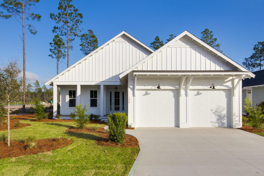 108 Sidecamp Road, Unit LOT 89 Watersound, FL 32461 - Photo 1 of 12 a front view of a house with garden