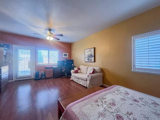 a bedroom with furniture and a window