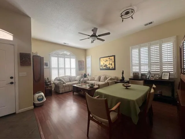 a view of a dining room with furniture and window
