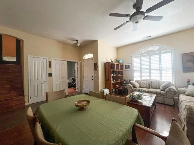 a room with furniture a window and a chandelier