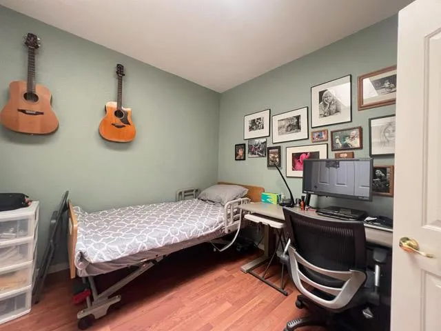 a bedroom with bed and a window