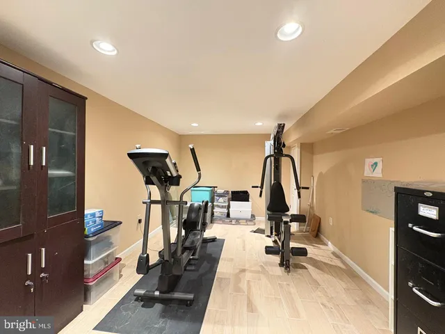 a view of gym equipment and windows
