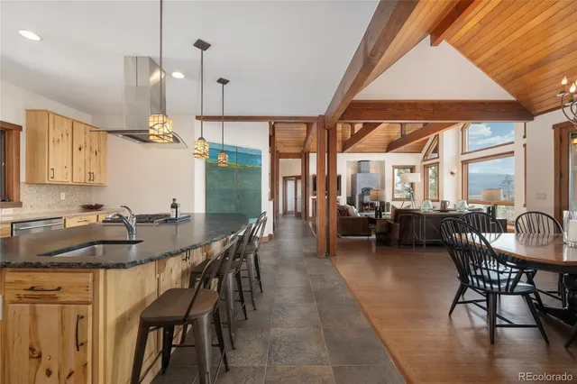 a view of a dining room with furniture window and outside view