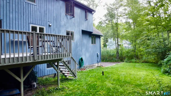 a view of a wooden deck front of house