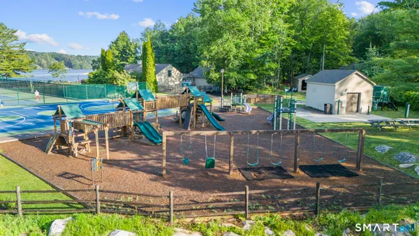 a view of a backyard with sitting area