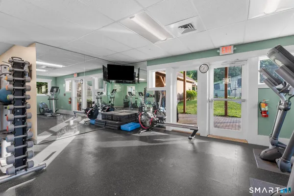 a view of a livingroom with hardwood floor and a ceiling fan