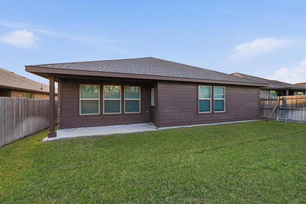 9308 Desertrock Road Fort Worth, TX 76131 - Photo 28 of 29 a view of front of a house with a yard