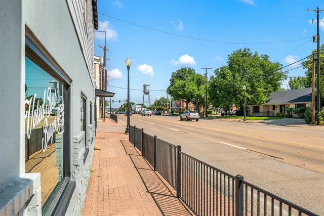 a street sign on a street next to a road