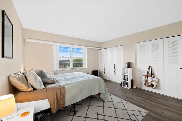 a bedroom with furniture and a window