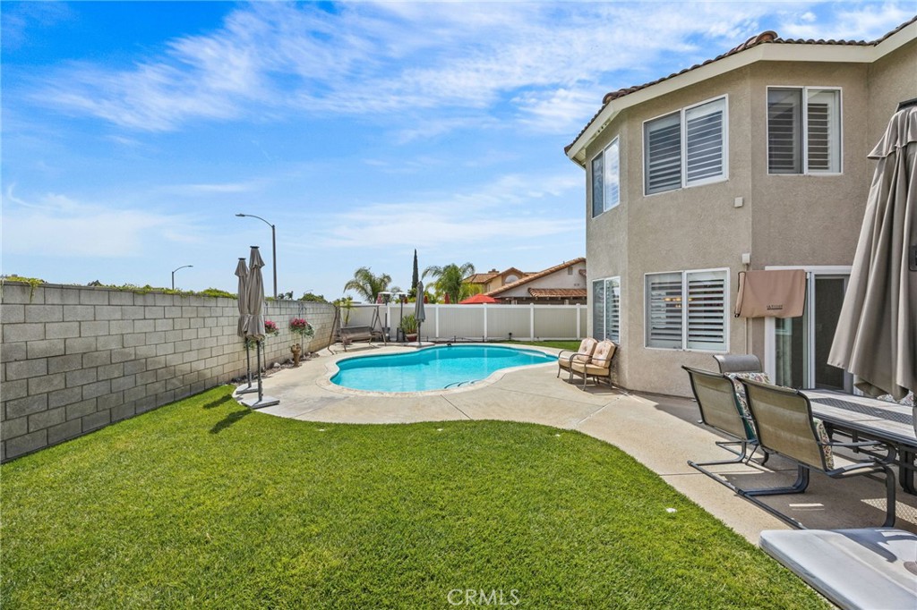 20257 Edmund Road Riverside, CA 92508 - Photo 41 of 53 a backyard of a house with table and chairs