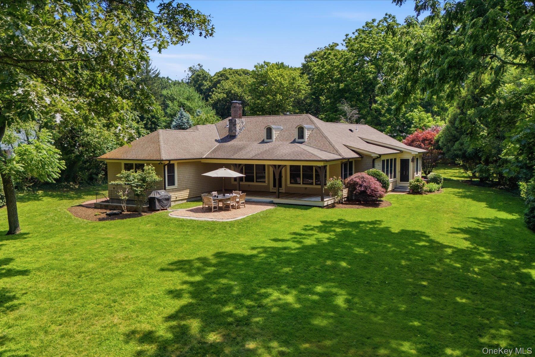 134 Sandy Hollow Road Northport, NY 11768 - Photo 25 of 28 Flat, professionally landscaped grounds offering exceptional outdoor living.
