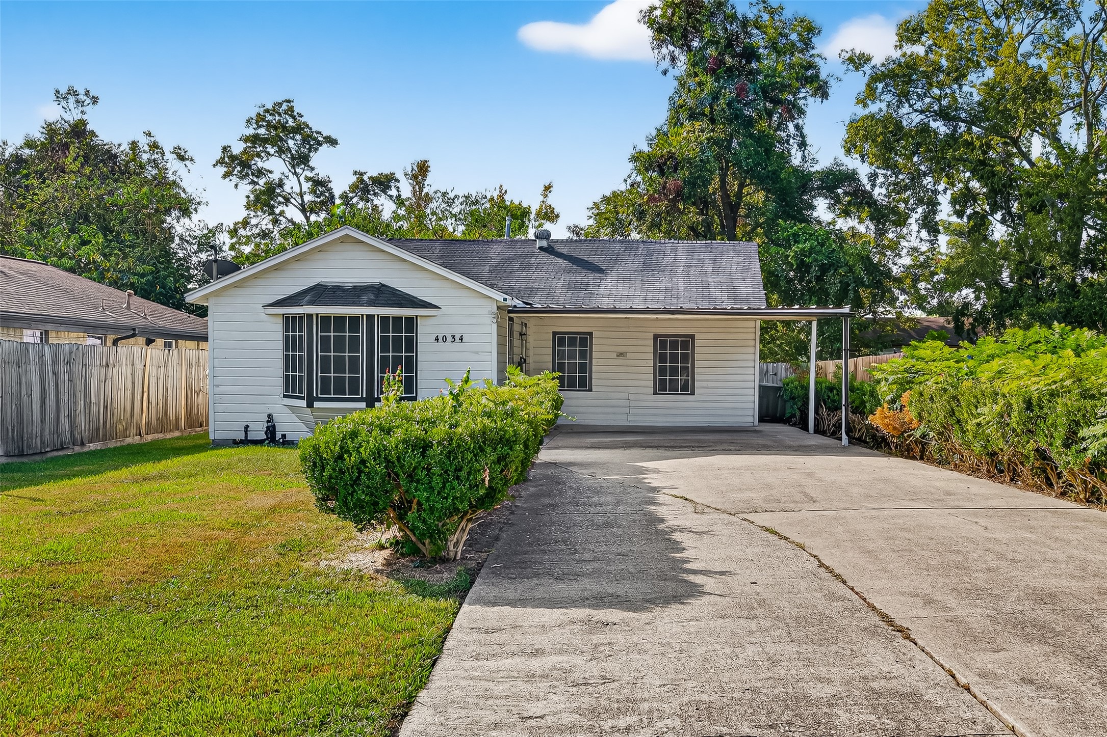 4034 Caplin Street Houston, TX 77026 - Photo 1 of 37 a front view of a house with garden