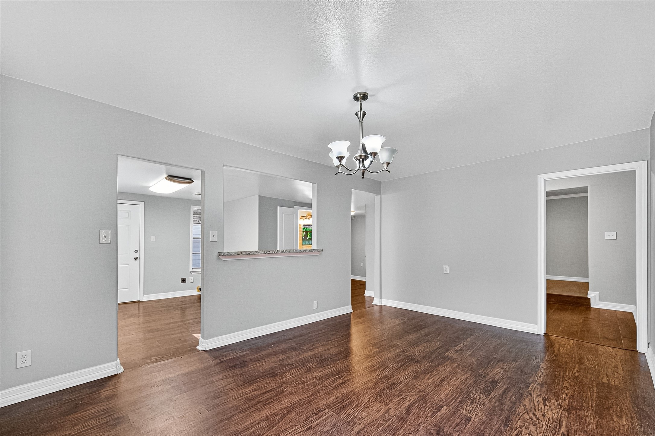 4034 Caplin Street Houston, TX 77026 - Photo 11 of 37 a view of an empty room with wooden floor