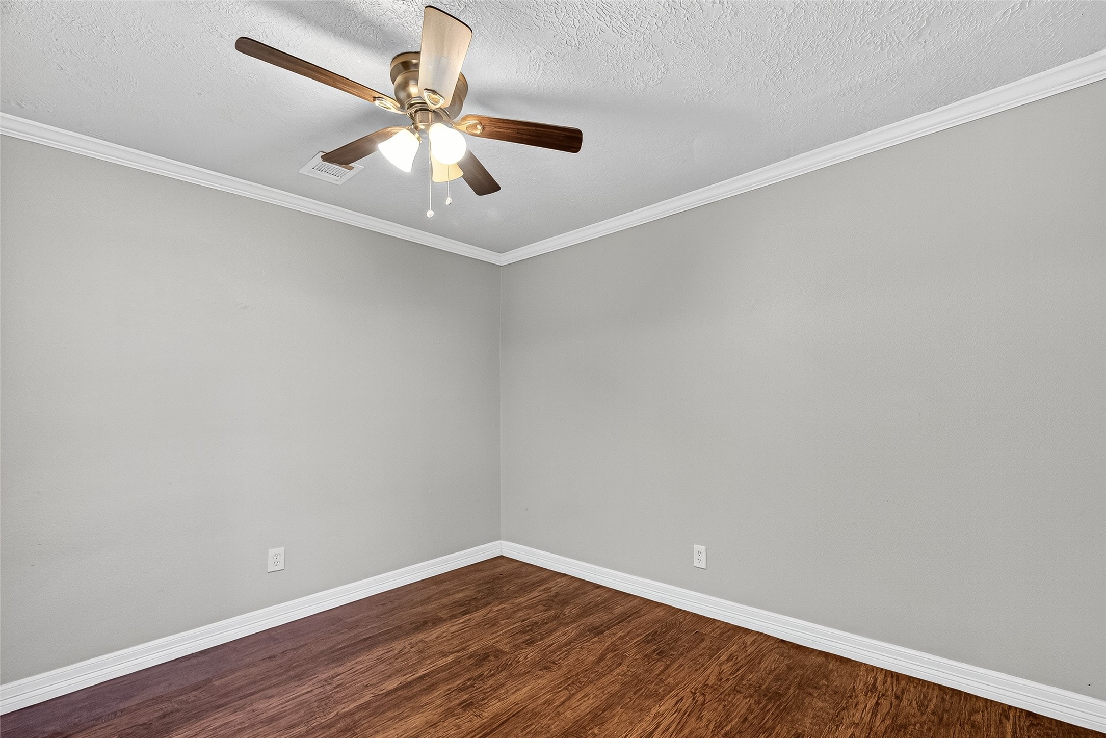 4034 Caplin Street Houston, TX 77026 - Photo 19 of 37 a view of an empty room with wooden floor