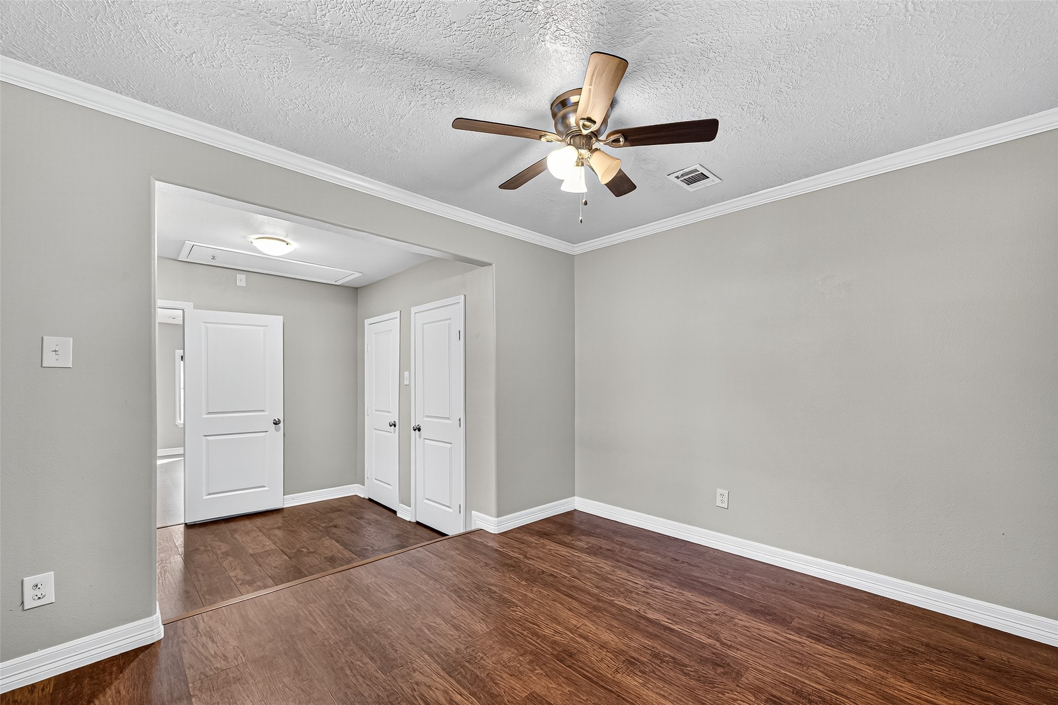 4034 Caplin Street Houston, TX 77026 - Photo 20 of 37 a view of an empty room with wooden floor