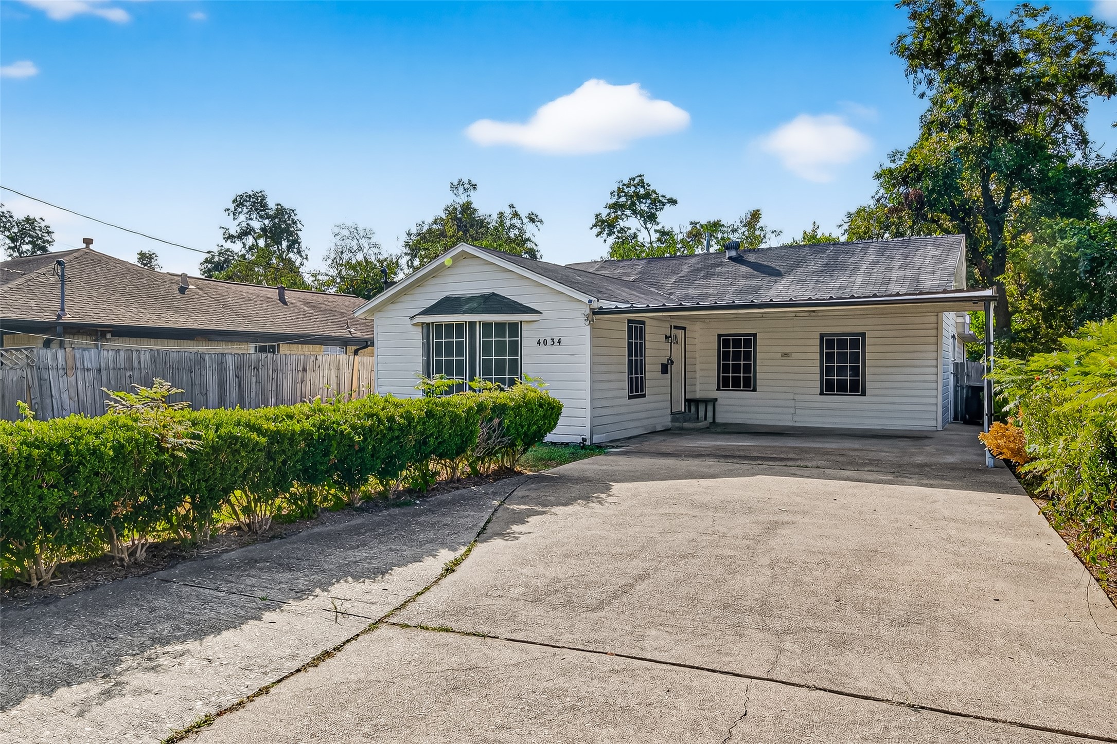 4034 Caplin Street Houston, TX 77026 - Photo 2 of 37 a front view of a house with a yard and potted plants