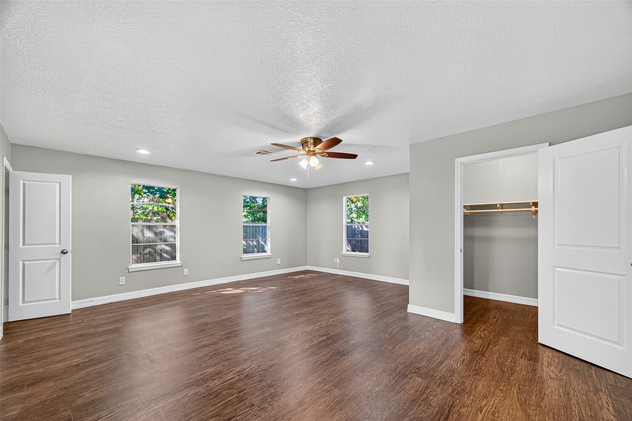 4034 Caplin Street Houston, TX 77026 - Photo 28 of 37 a view of an empty room with window and wooden floor