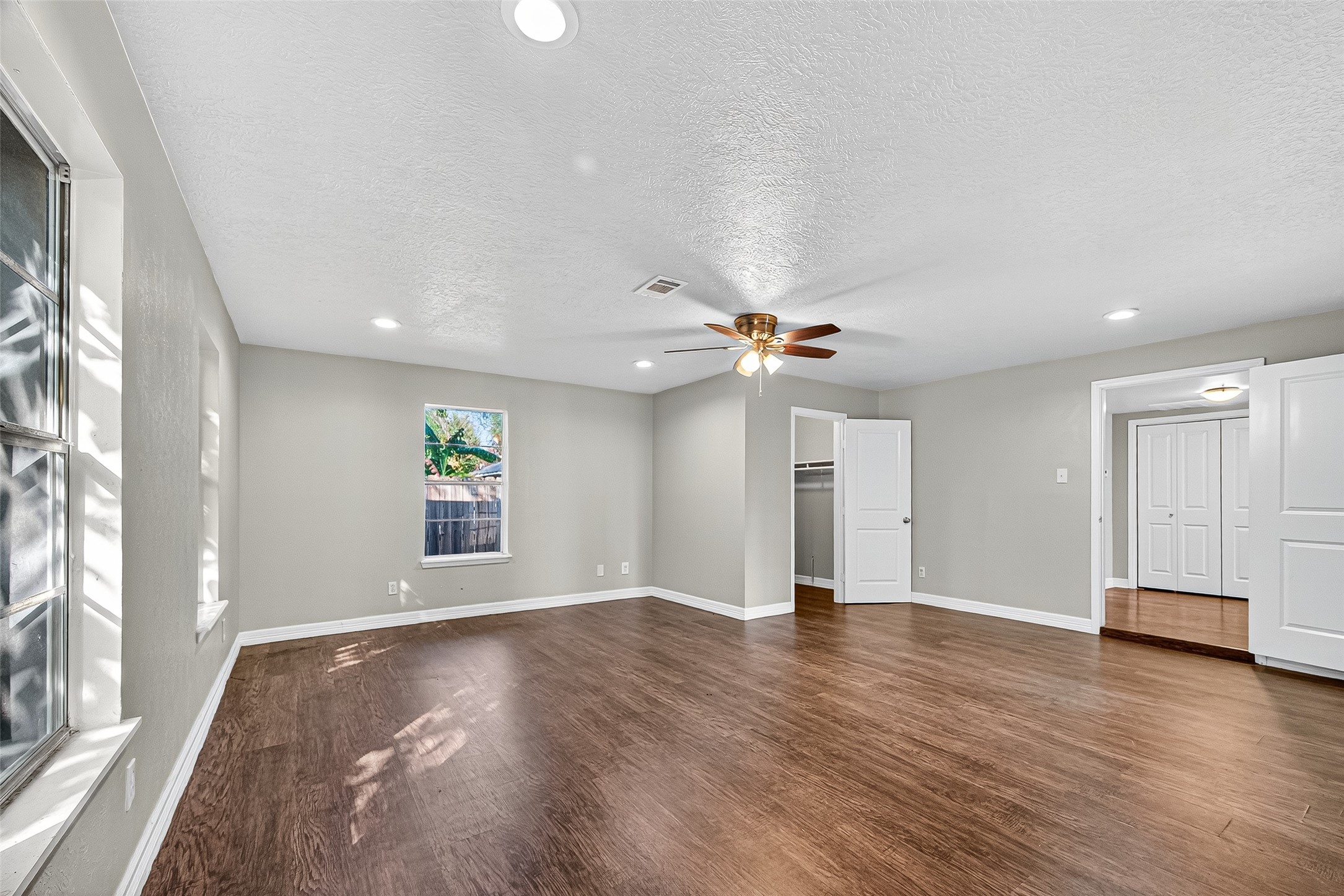 4034 Caplin Street Houston, TX 77026 - Photo 29 of 37 wooden floor in an empty room with a window