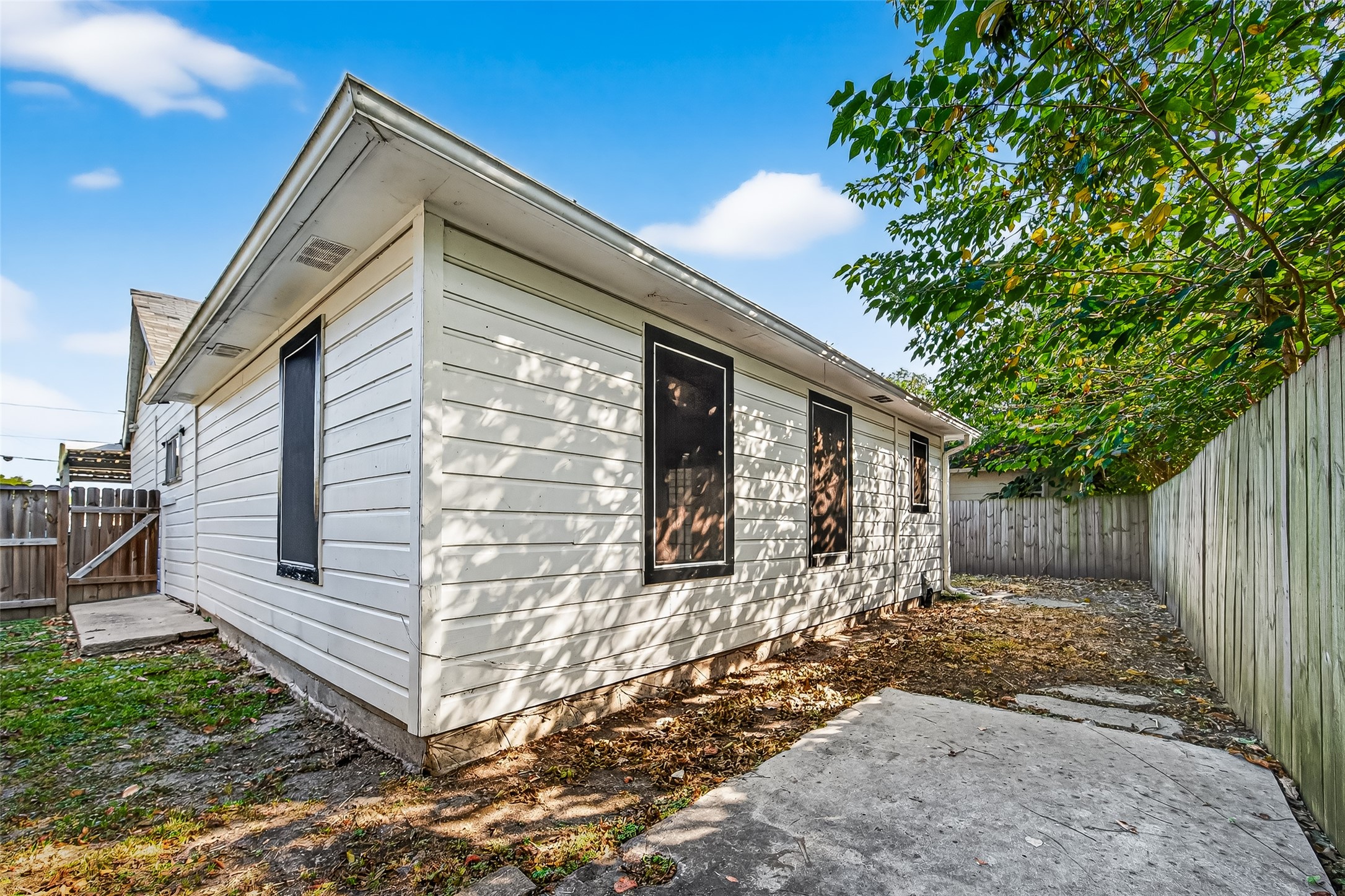 4034 Caplin Street Houston, TX 77026 - Photo 34 of 37 a view of a house with a yard