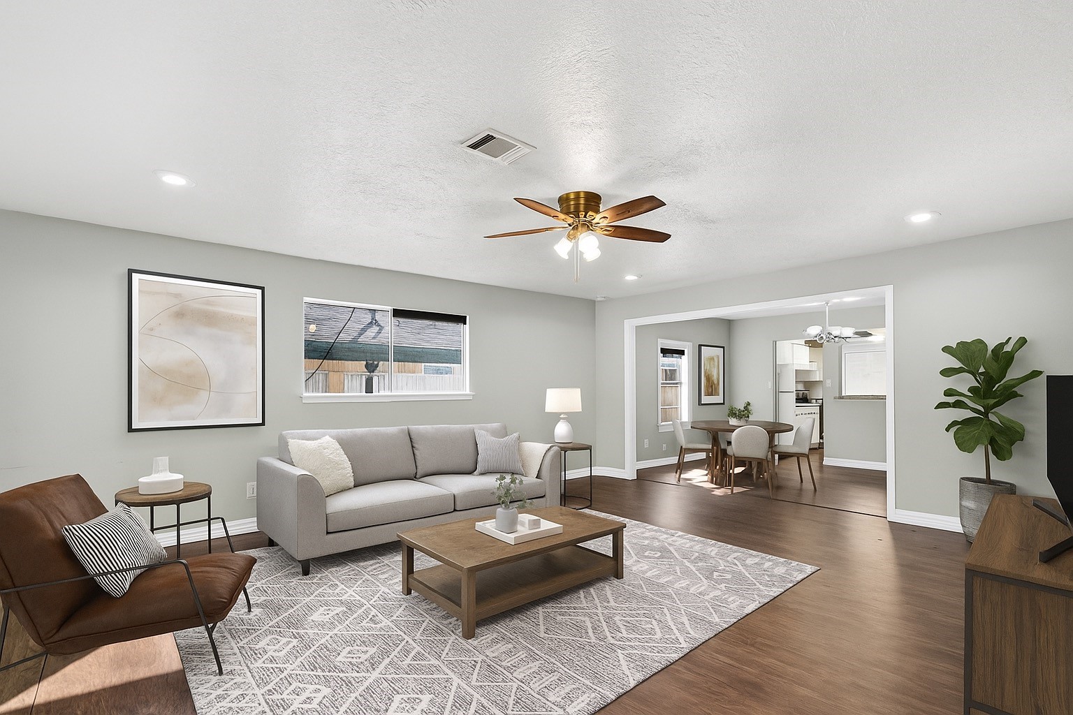 4034 Caplin Street Houston, TX 77026 - Photo 9 of 37 a living room with furniture and wooden floor