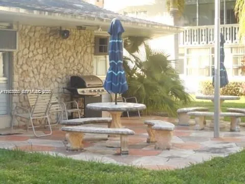 a front view of a building with a yard