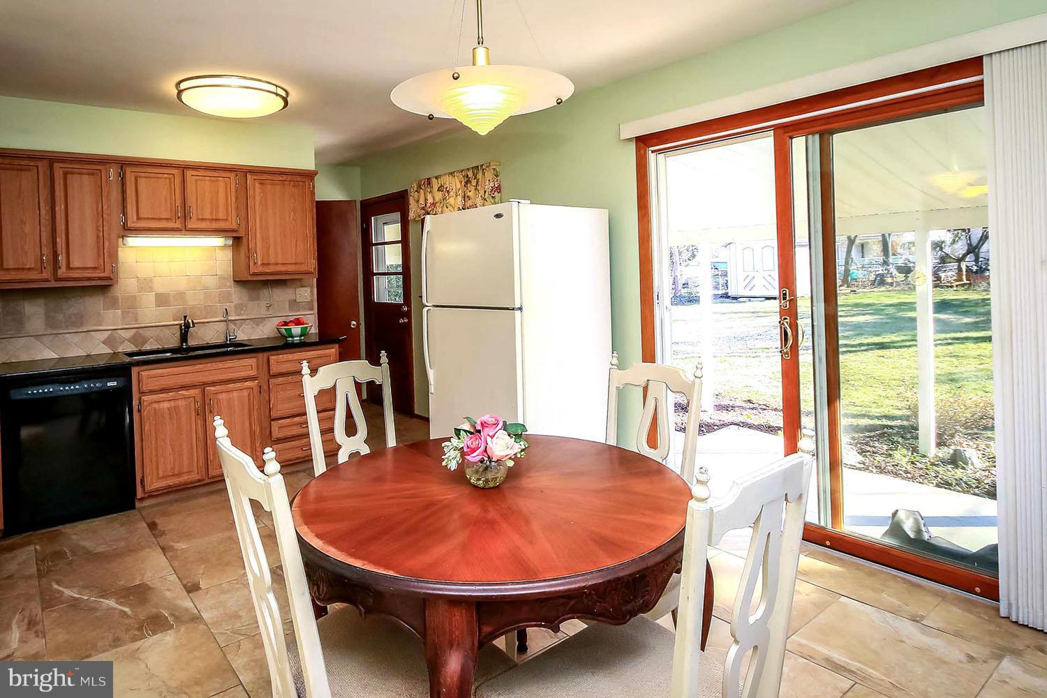 112 Brent Road Arnold, MD 21012 - Photo 4 of 30 Kitchen/Dining Area Spilling Out to Patio and Yard