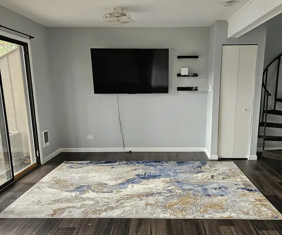 a view of a livingroom with wooden floor