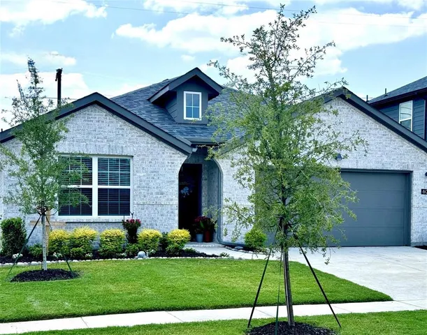 a kitchen with stainless steel appliances kitchen island granite countertop a sink and cabinets