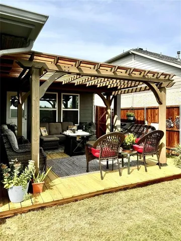 a view of a chairs and table in the patio