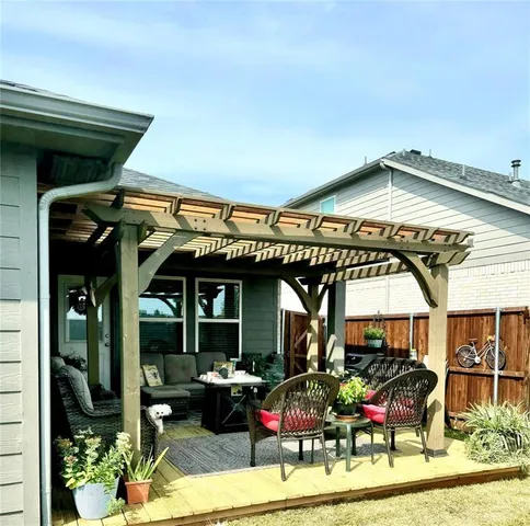 a view of a chairs and table in a patio