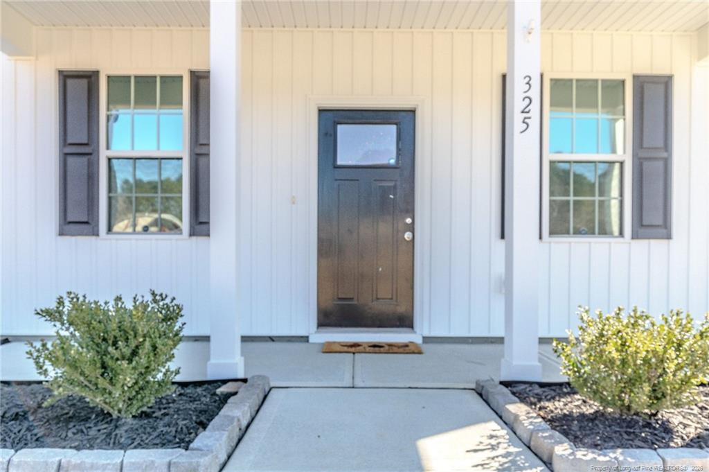 325 Ray Byrd Road Lillington, NC 27546 - Photo 2 of 26 a building with entryway