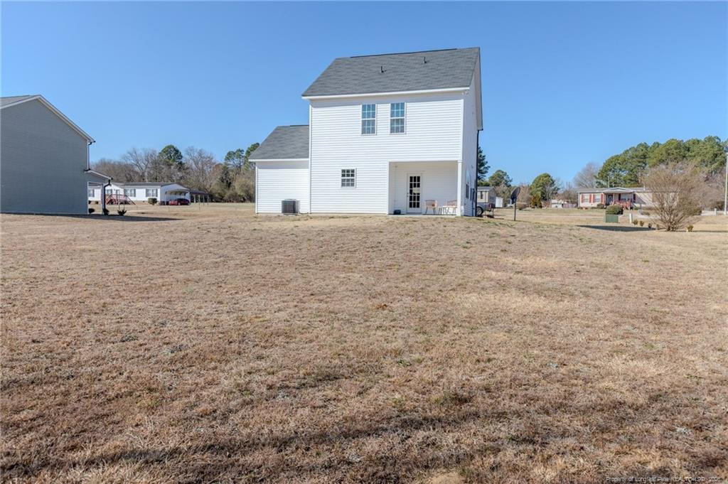 325 Ray Byrd Road Lillington, NC 27546 - Photo 26 of 26 a view of a house with a yard