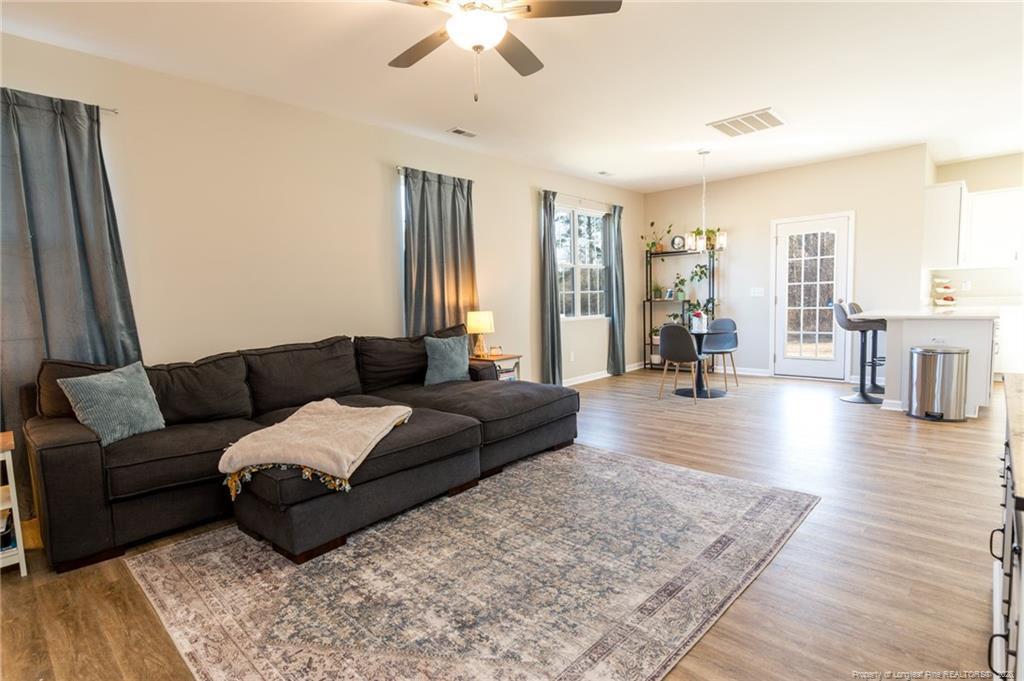 325 Ray Byrd Road Lillington, NC 27546 - Photo 3 of 26 a living room with furniture and a wooden floor