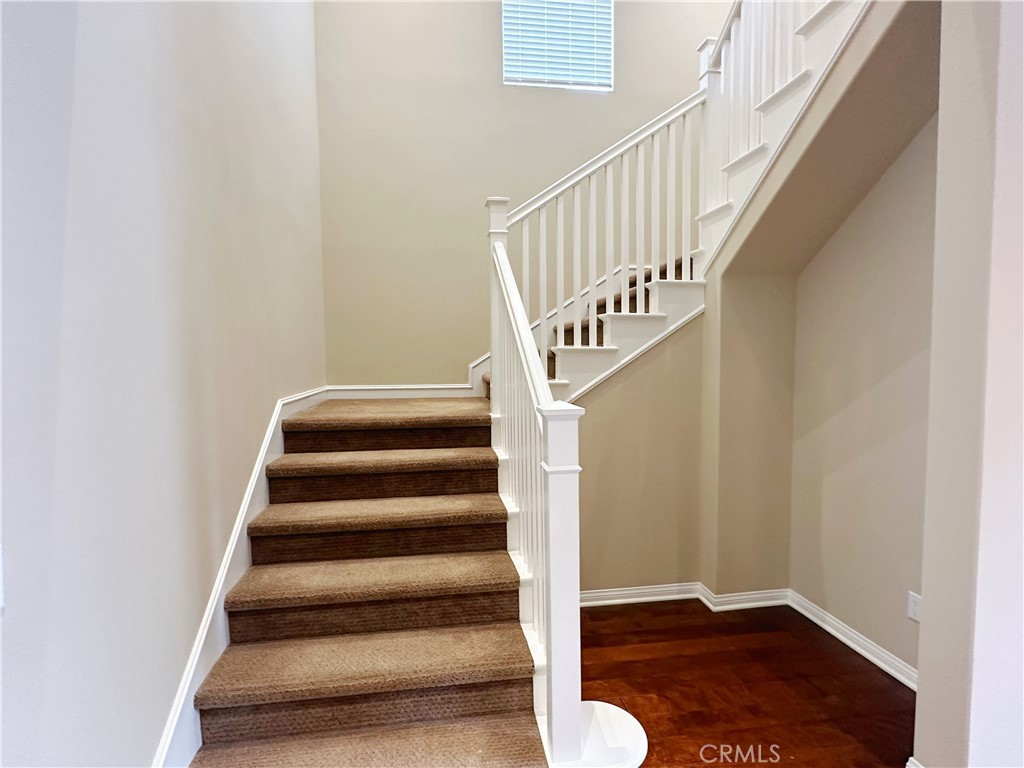 65 Elmdale Irvine, CA 92620 - Photo 4 of 8 a view of entryway with wooden floor