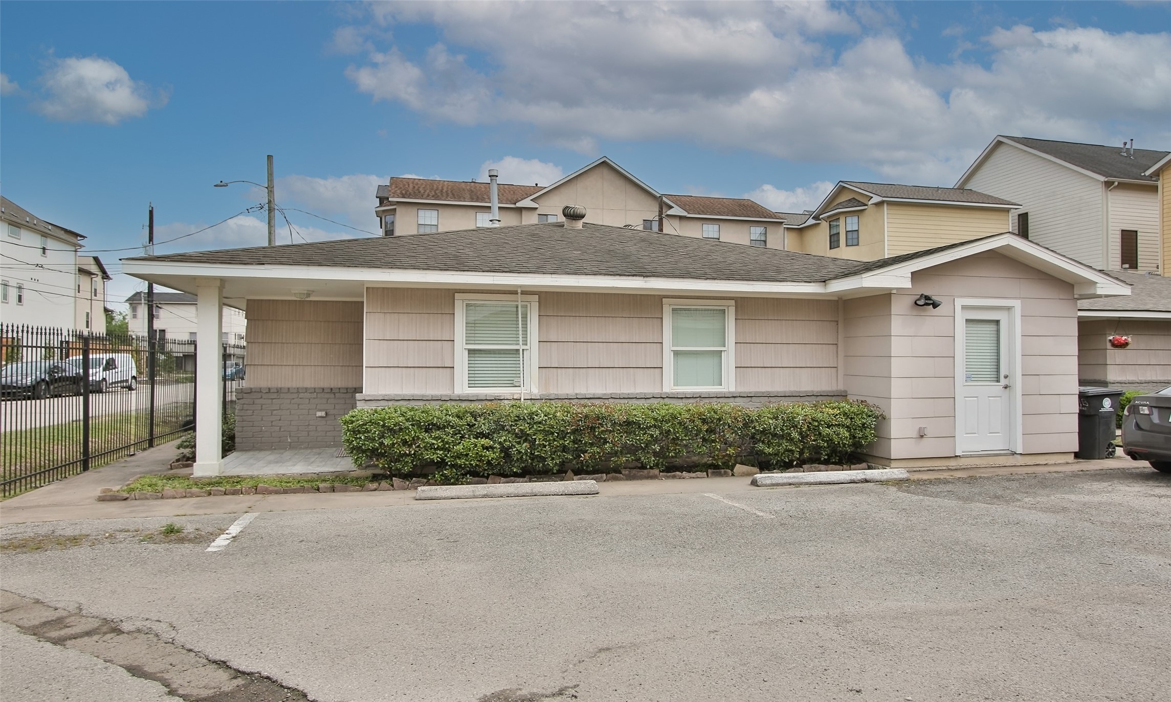 4331 Marina Street, Unit B Houston, TX 77007 - Photo 27 of 37 a front view of a house with a yard and garage