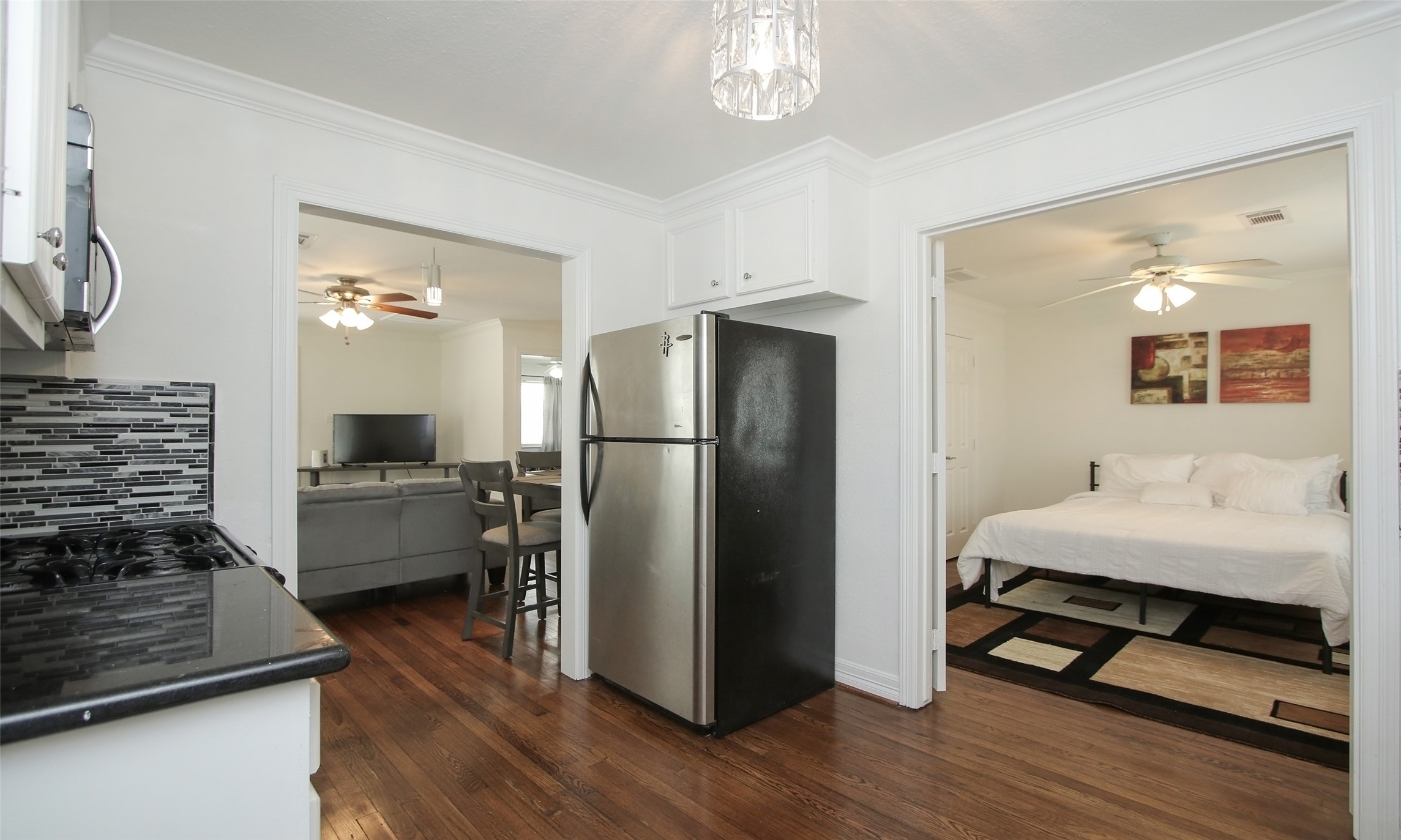 4331 Marina Street, Unit B Houston, TX 77007 - Photo 3 of 37 a kitchen view with a refrigerator and a stove top oven