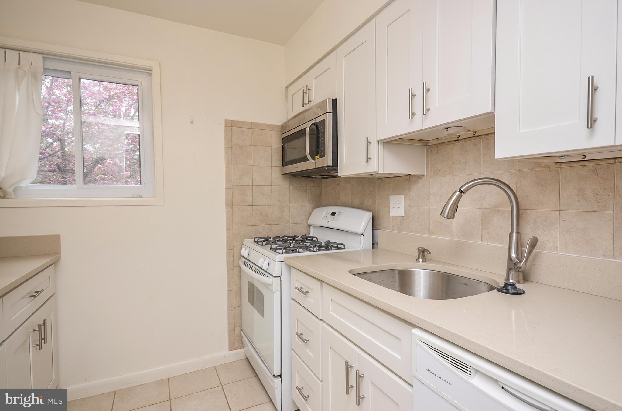 11607 Elkin Street, Unit 101 Silver Spring, MD 20902 - Photo 5 of 19 Kitchen w/ brand new countertops and cabinetry!