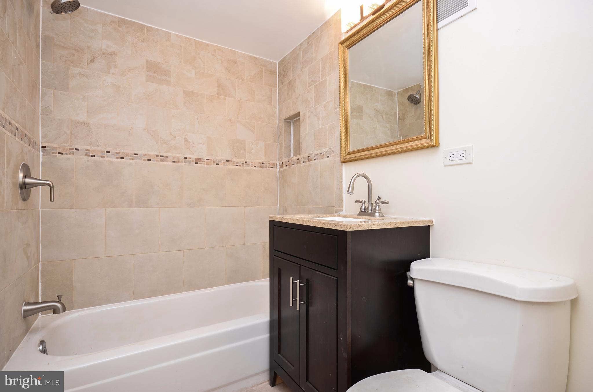 11607 Elkin Street, Unit 101 Silver Spring, MD 20902 - Photo 9 of 19 Renovated bathroom
